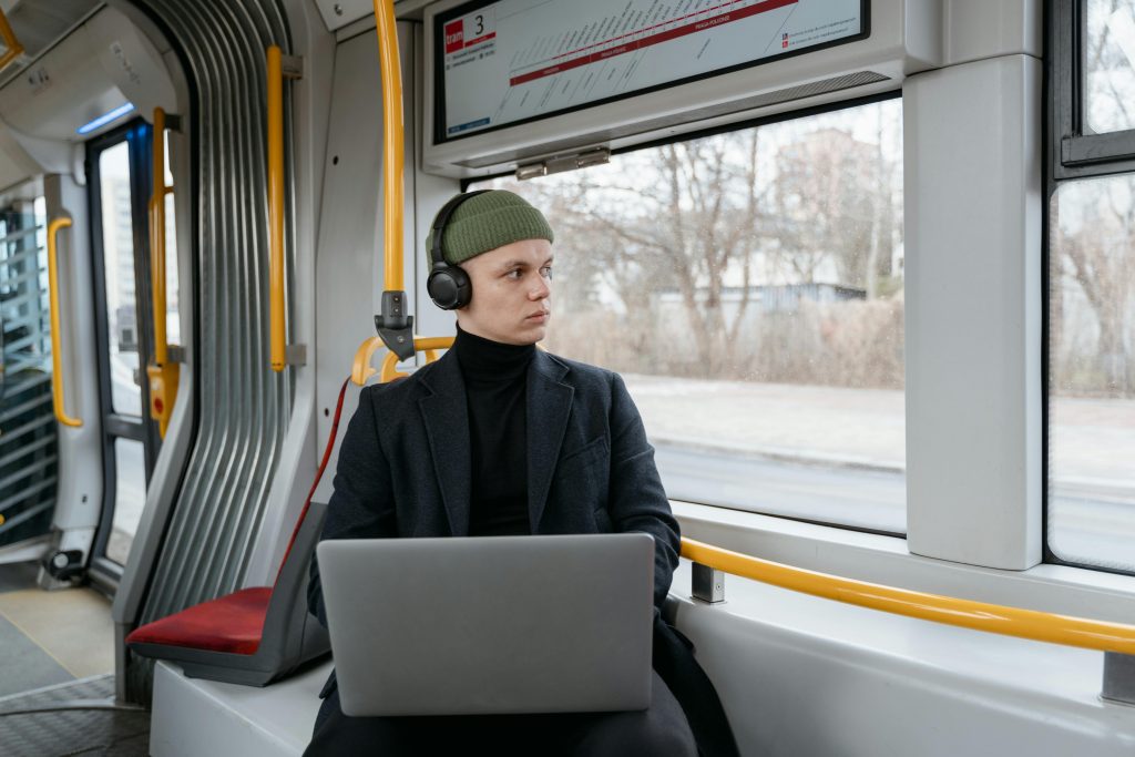 Traveler using Jabra Elite 75t earbuds, highlighting their compact and portable design during a trip.